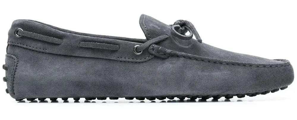 a moccasin-inspired shoe featuring 133 rubber pebbles embedded in the sole